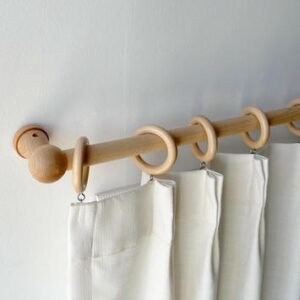 Wooden curtain rod design installed